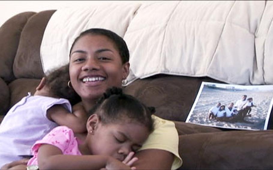 Crystal Young relaxes in her Waldorf, Md. home with her daughters Cayla, left, and Cydney.