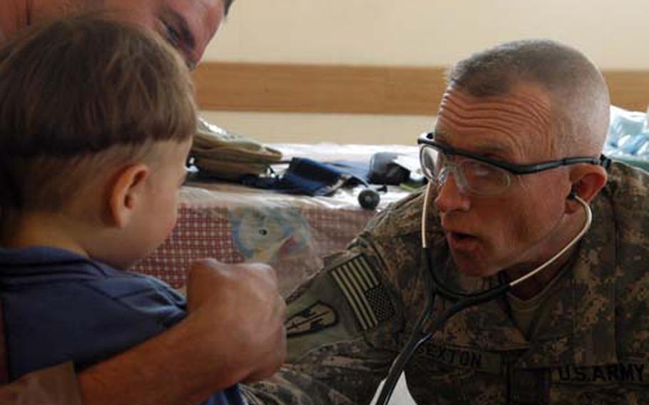 Maj. Robert Sexton returned to the Army after an almost 40-year hiatus, turning his career as a physician into a medical officer slot with the 425th Civil Affairs Battalion. He said a sense of duty motivated him. He spends his days largely outside of Camp Liberty, engaging in various projects like this free clinic day Wednesday in Baghdad.