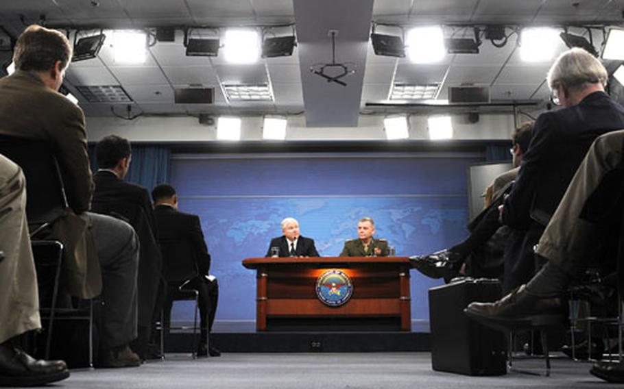Defense Secretary Robert M. Gates and Marine Gen. James Cartwright, vice chairman of the Joint Chiefs of Staff, speak to members of the press about the fiscal year 2010 budget Monday at the Pentagon.