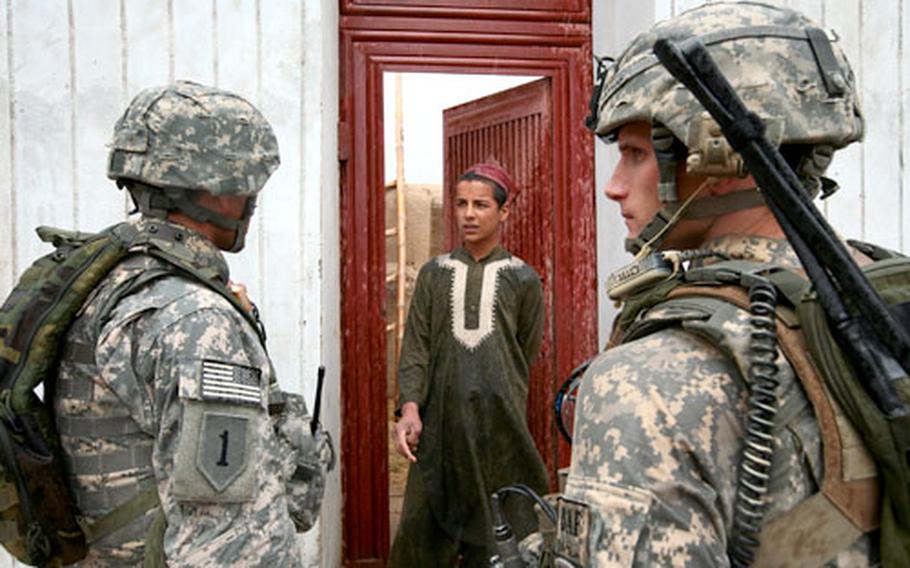 First Lt. Matt Pathak, 26, of Jacksonville, Fla., a soldier with Company C, 2nd Battalion, 2nd Infantry Regiment, talks to a boy in the village of Mazar&#39;eh, in Mazar&#39;eh, in Maiwand district, Afghanistan. The soldiers have spent most of their deployment on security operations and trying to gain the trust of villagers, many of whom are reluctant to cooperate.