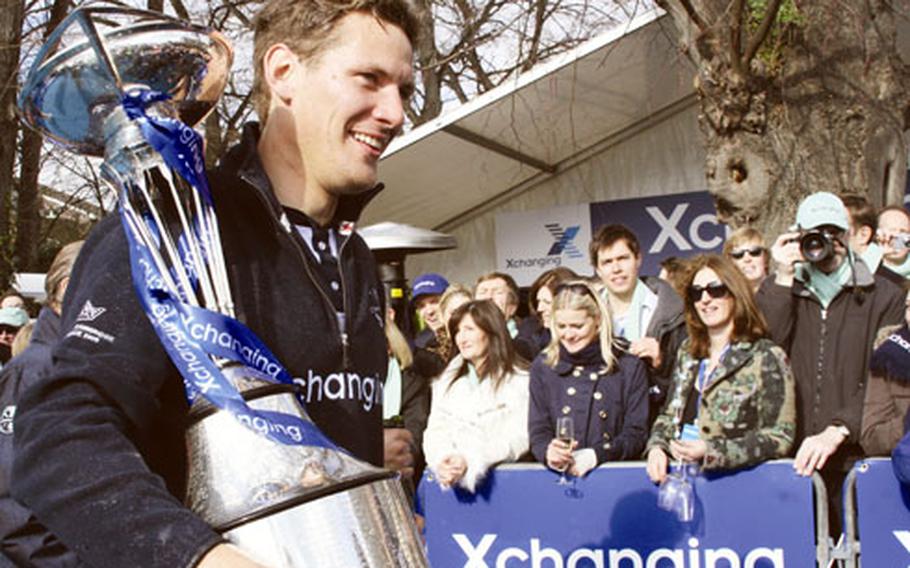 Sjoerd Hamburger walks through the crowd with the trophy.