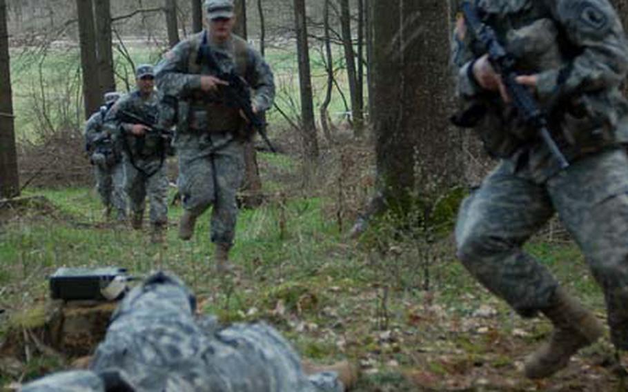 Spc. Shawn Ladyman, right, followed by Spc. Christopher Latona, Spc. David Morales and Pfc. Brandon Jefferson, all members of 173rd Airborne Brigade Combat Team, rush to the aid of Spc. Michelle Juneau on Wednesday during the first aid portion of the first Sky Soldier Competition at Camp Robertson near Schweinfurt, Germany.