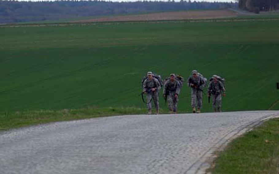 A team of 173rd Airborne Brigade Combat Team soldiers continue a long road march Wednesday during the first Sky Soldier Competition at Camp Robertson near Schweinfurt, Germany. During the competition the soldiers had to complete a total of 12 miles on foot.