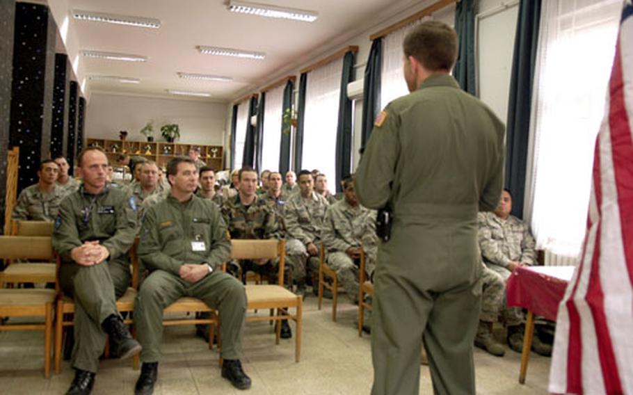 U.S. Air Force Col. John Zazworsky, the commander of the Heavy Airlift Wing, addresses some of his troops, which are a mix of Norwegian, Swedes, Hungarians and others. An American was designated to command the multinational group because the U.S. is the only nation with C-17 flying experience. However, the leadership position will rotate among members as the other countries gain flying experience.
