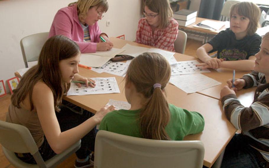 A classroom of American and Swedish children work on their Hungarian language skills, trying to learn the basics as part of a bilingual program at the local primary school. Blending the children from up to 11 countries into the Hungarian school system could be the biggest challenge facing the new Heavy Airlift Wing.