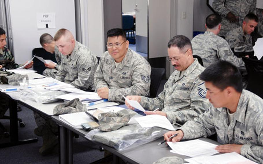 Members of the 35th Civil Engineer Squadron at Misawa Air Base, Japan, fill out travel claims Thursday after returning from the Silver Flag training exercise on Kadena Air Base, Okinawa.