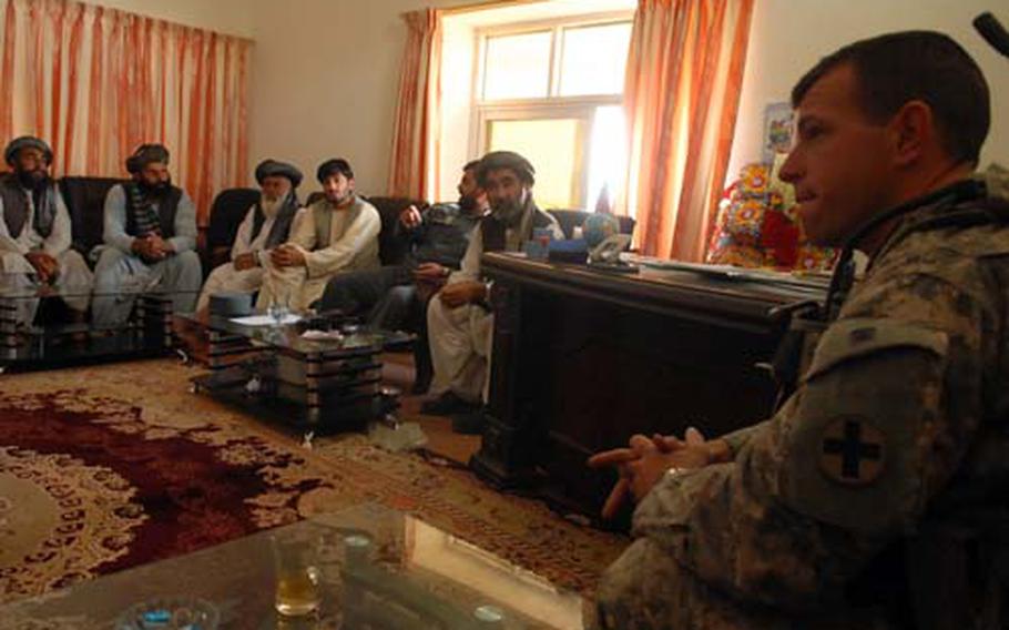 Capt. Kenton Patrick, police mentoring team leader for the Arghandab district, talks to village elders Thursday at a weekly shura, or council, in Baba Shabdoray, Afghanistan.