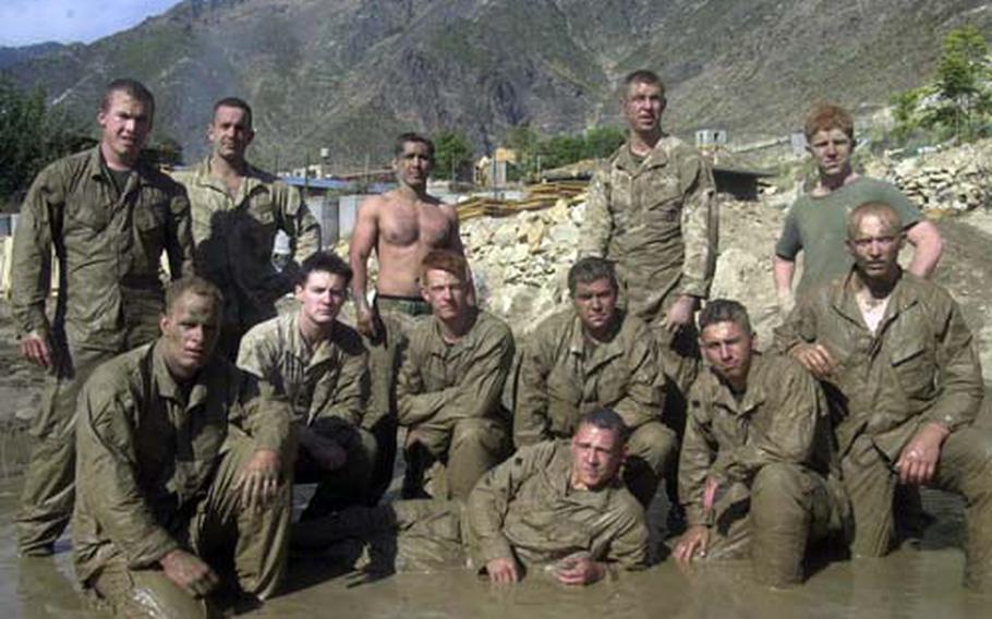 Marines with 2nd Battalion, 3rd Marine Regiment pose for a picture after a martial-arts training session in the fall of 2005 at Camp Blessing in eastern Afghanistan. Camp Blessing plays a prominent role in Ed Darack’s new book “Victory Point,” which highlights the efforts of the 2nd Battalion, 3rd Marine Regiment during 2005’s Operation Red Wings and Operation Whalers.