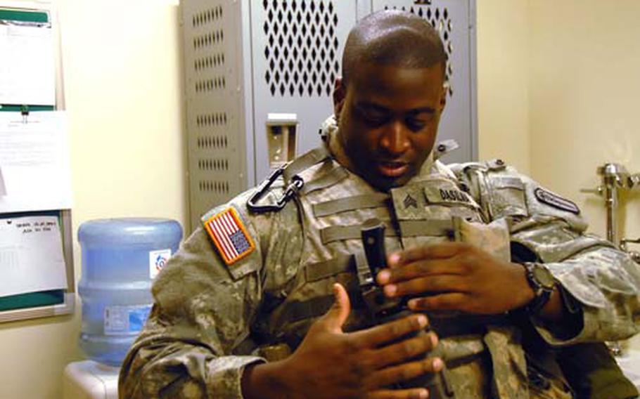 Sgt. David Dasilima gets ready at the Brian Allgood Community Hospital for land navigation practice. Dasilima, who works at the immunization clinic, was recently named the U.S. Army&#39;s Medical Command Noncommissioned Officer of the Year -- Best Warrior. He will compete for NCO of the Year this fall against soldiers from all commands in the Army.