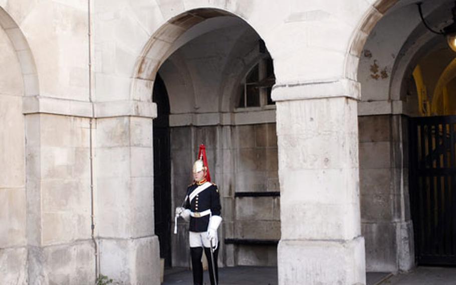 A Blues and Royals soldier stands guard at the Horse Guards building near the museum.