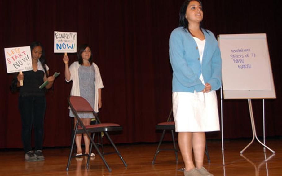 Katherine Ampong, 17, left, Josie Herrera, 17, center, and Brooke Ramos, 15, perform Wednesday in a skit about the life of feminist activist Betty Friedan. About 100 students participated in the Okinawa district history competition.