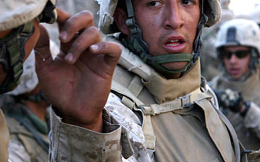 Exhausted from wearing 50 pounds of body armor and other gear, Lance Cpl. Arturo Gomez, catches his breath before continuing with a training exercise.