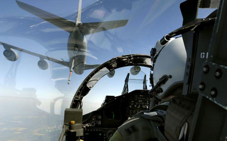 An F-15 Eagle pilot assigned to the 493rd Fighter Squadron moves into position to receive fuel from a KC-135 Stratotanker during a training mission over Eastern Romania in 2007.