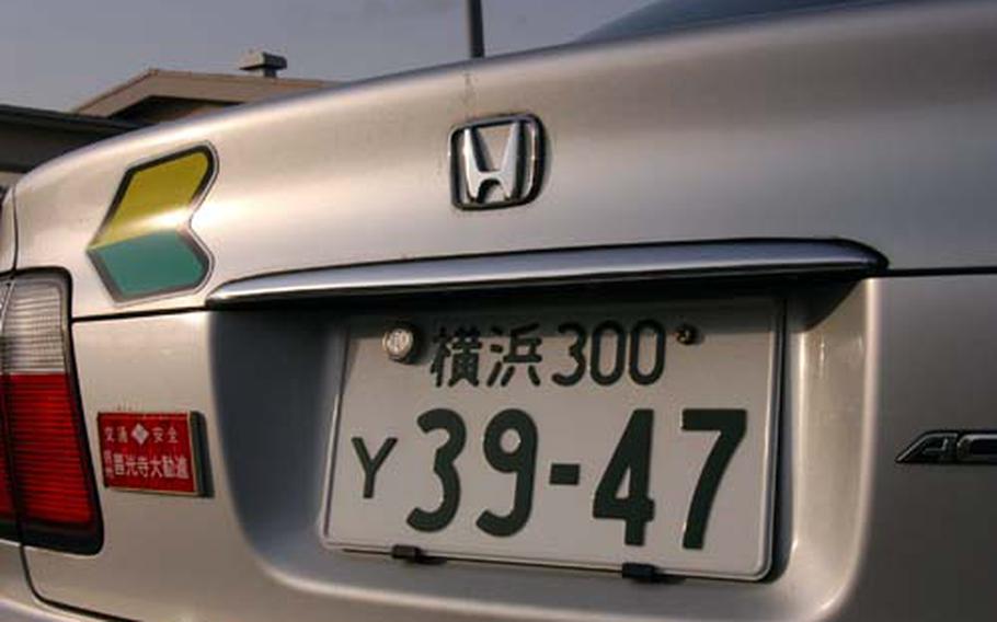 A vehicle like this Honda with a 300 on the plate will cost a driver 19,000 yen (about $185) in annual Japanese road tax this year. Bases throughout Okinawa will allow drivers to pay on base at select times.