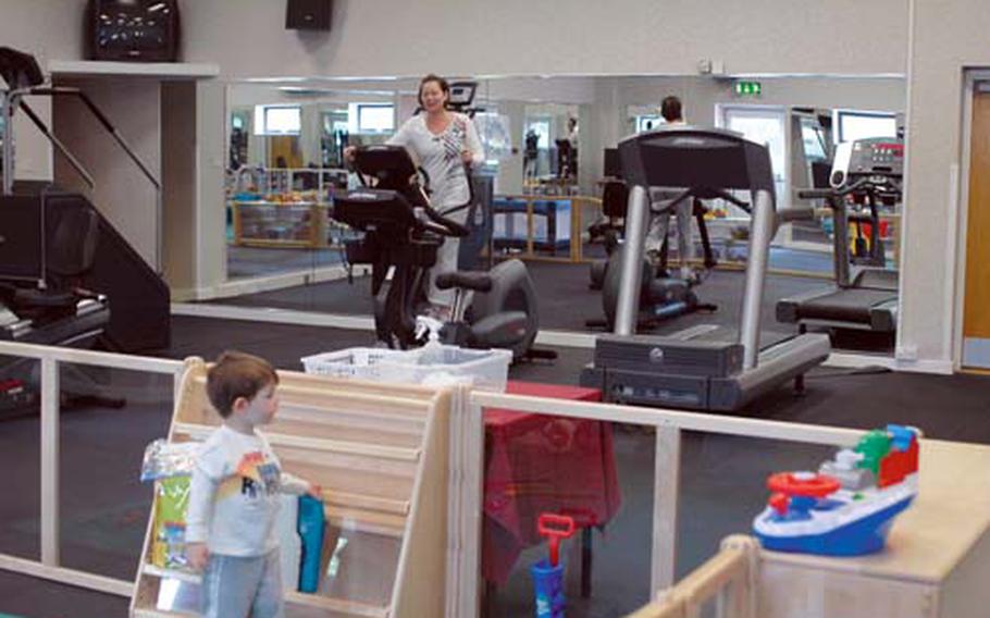 Haynes works out while her son, 3-year-old Landon, plays in the new Parent Child Area at RAF Mildenhall’s Northside gym.
