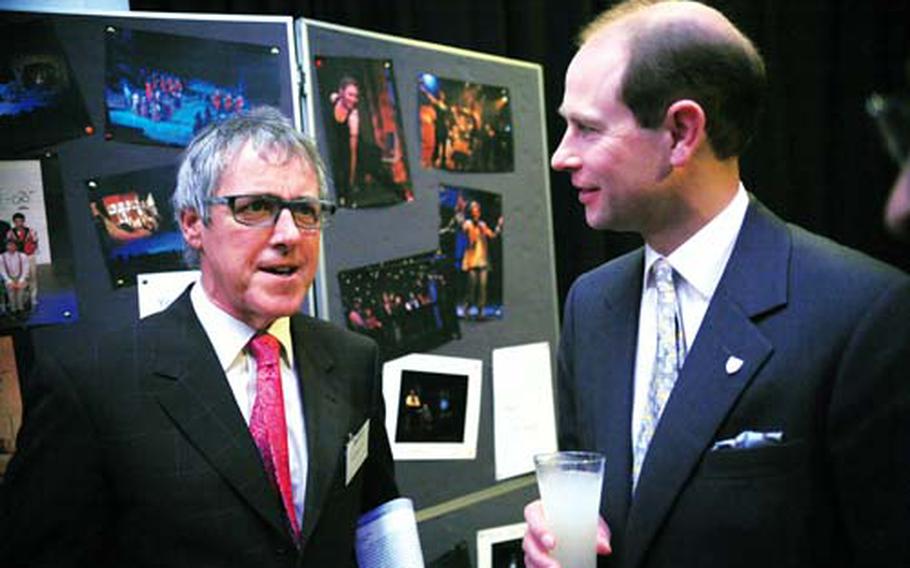 Prince Edward, right, speaks to Griff Rhys Jones, a theater alumnus, last month during a gala performance to celebrate the 800th anniversary of the founding of the school.