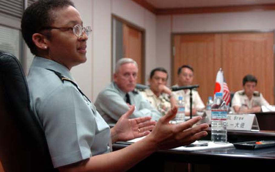 Col. Marilyn Brew speaks to a gathering of U.S. Army-Japan and Japanese Ground Self-Defense Force health officials at Tuesday&#39;s suicide prevention meeting at the Ministry of Defense in Tokyo.
