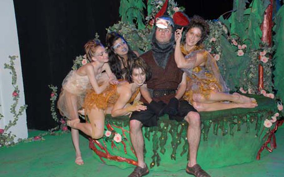 Eric Hanson, who played "Bottom" in Stuttgart Theatre Center&#39;s production of "A Midsummer Night&#39;s Dream," is surrounded by fairies — clockwise from right — Chantel Schurr, Angel Winge, Kenidy Springer and Rebecca Clare. During the Tournament of Play&#39;s annual award ceremony on April 18, Hanson won a Topper for best military performance in a play, and the production won technical awards for makeup, costumes and stage design. Stuttgart won a total of 13 awards, the most of any participating theater groups.