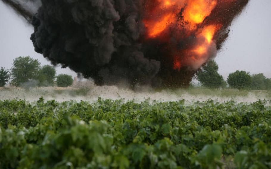 A blast set by a bomb disposal team destroys a Taliban weapons cache found by U.S. soldiers with Company A, 2nd Battalion, 2nd Infantry Regiment in of Mira Hor.
