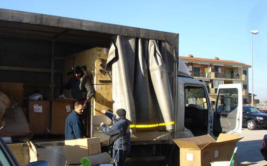Movers help unload boxes of household goods from a truck in Naples. A rash of personal property thefts last year left many Naples, Italy, residents uneasy about moving their household goods. Multiple layers of prime contractors and subcontractors makes it difficult to track down who is responsible for lost items and how to discipline them.