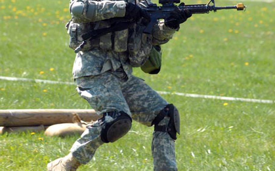 Spc. Terry Baker, a 2nd Stryker Cavalry Regiment soldier, practices individual movement techniques Wednesday in preparation for Expert Infantryman’s Badge testing. “You have to use the proper techniques to get from one concealed position to another,” a sweaty Baker said after completing the course. “It can be hard if you don’t stay on top of it.”