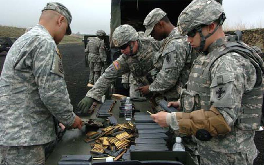 35th Combat Sustainment and Support Battalion soldiers sort through ammo during their one-week stay at Camp Fuji, where they conducted weapons training to update their soldier qualifications.