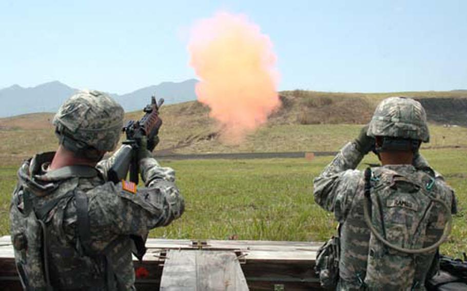 A nonlethal 40 mm grenade explodes seconds after a 35th Combat Sustainment and Support Battalion soldier shoots it while training on the grenade launcher at Camp Fuji.