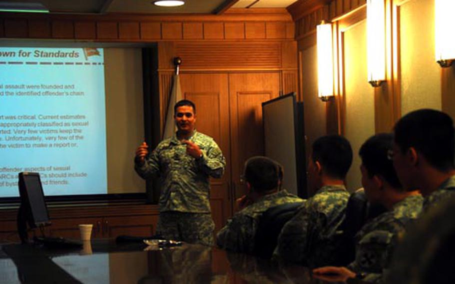 Master Sgt. Hector Andreu leads a session about sexual assault reporting and prevention during the "Stand Down for Standards" training Saturday. The training was mandatory for all U.S. Forces Korea servicemembers and was meant to reverse a rise in discipline problems that began after the weekend curfew was shortened to two hours last summer.