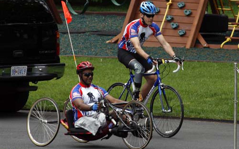 Combat-injured veterans taking part in this year’s Soldiers Ride cruise past the White House playground on Thursday at the Wounded Warrior Project’s kick-off ceremony for the annual event.