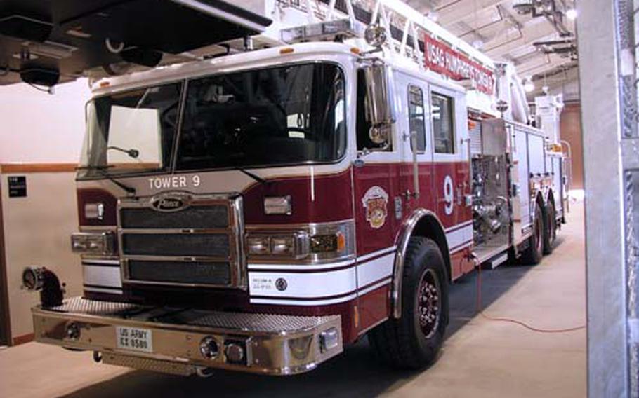A 100-foot platform fire truck is parked inside a firehouse newly built mainly for the firefighting vehicle, in the post’s MP Hill section.