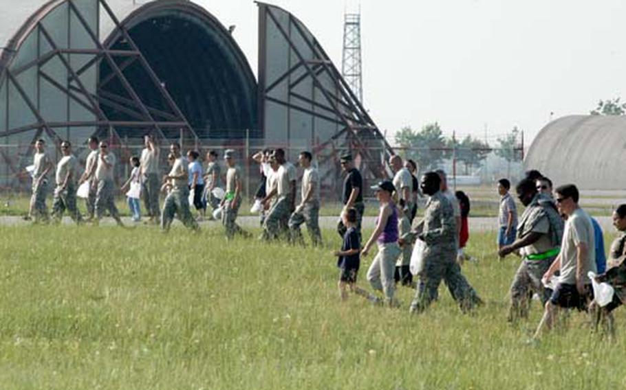 More than 100 people volunteered to participate in a rabbit roundup at Aviano Air Base last Tuesday. The line of people forced rabbits to break from their cover and about a dozen were captured as they ran into nets strung up by Italian rangers.