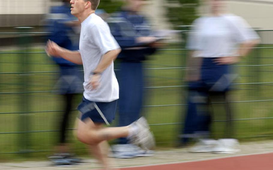 Capt. Etienne Miszczak,an JAG officer, runs the mile and a half portion of his Air Force physical fitness test last month at Ramstein Air Base, Germany.