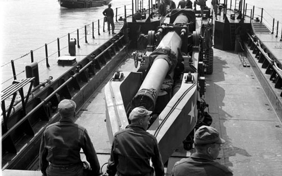 280mm "atomic cannons" are ferried across the Rhine during Operation Big Lift in May, 1954.