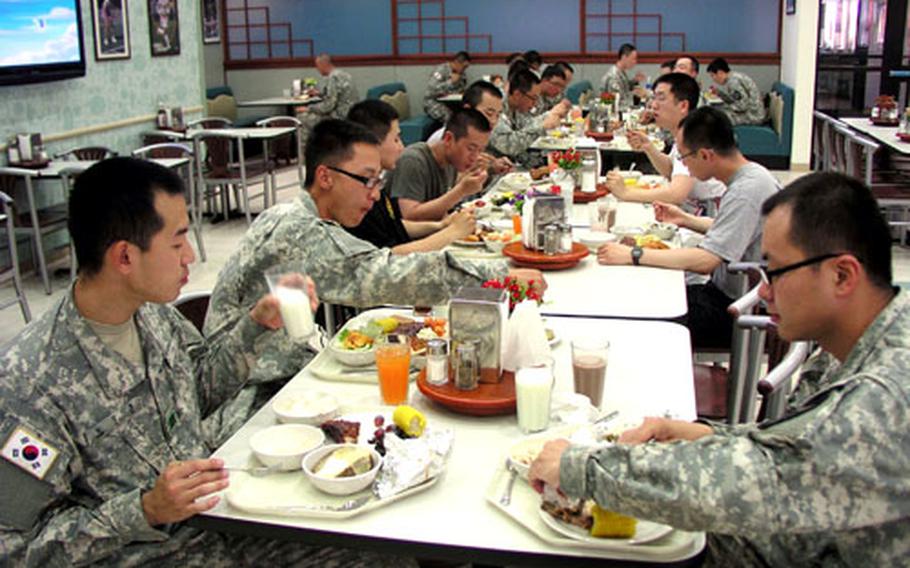 Soldiers eat dinner inside the recently-opened Talon Café at Camp Humphreys.