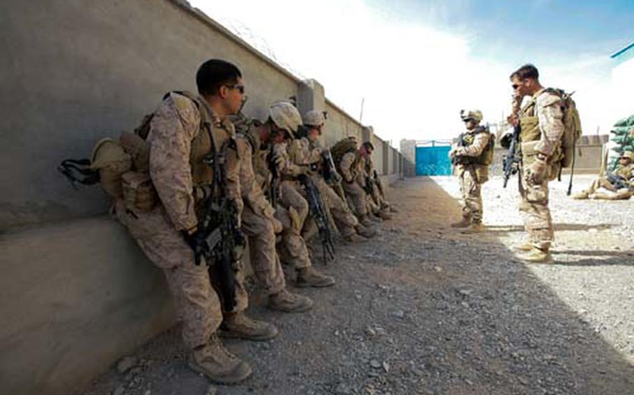 Members of Company I, 3rd Battalion, 4th Marine Regiment prepare to head out on patrol in the town of Delaram in southwestern Afghanistan&#39;s Nimruz province. A platoon of Marines has been posted in the town for the last two years alongside local police in an effort to bolster security, but tangible results have been slow in coming.