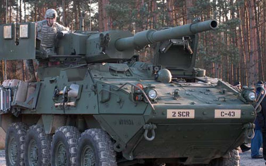 A 2nd Stryker Cavalry Regiment soldier sits atop a Mobile Gun System at at Grafenwoehr Training Area, Germany, on Thursday. The soldiers were demonstrating the weapon for for delegates from the Organization for Security and Cooperation in Europe.