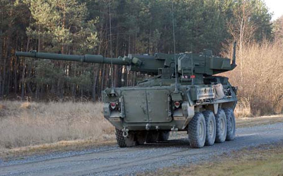 A 2nd Stryker Cavalry Regiment Mobile Gun System drive along a road at Grafenwoehr Training Area, Germany, on Thursday. The MGS, fielded the first time in Europe, can fire four different types of ammunition, depending on the situation.