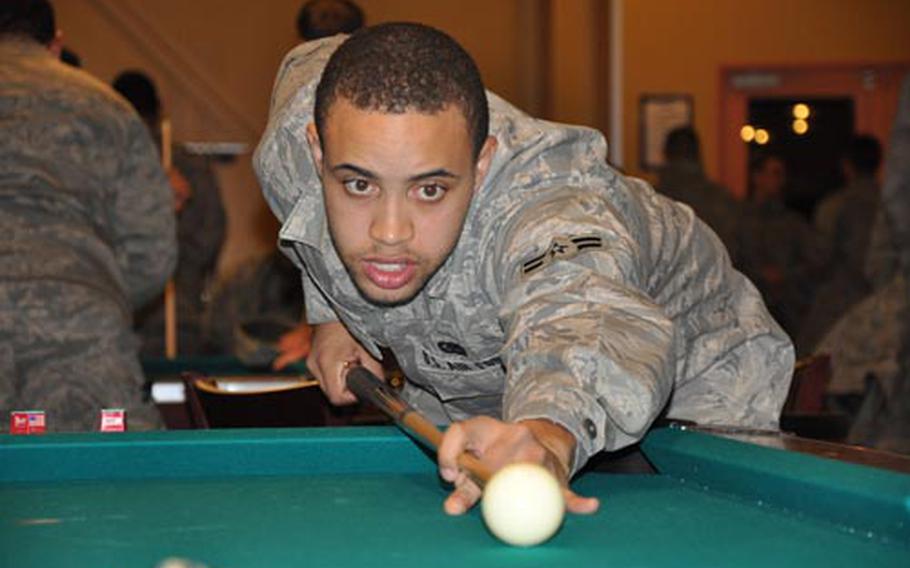 Airman 1st Class Doctavious French, with the 35th Logistical Readiness Squadron, shoots a game of pool during an open house at the $1.3 million Airmen Center on Thursday at Misawa Air Base, Japan. The center, for any military member in the ranks of E-1 to E-4, opened officially Friday night.