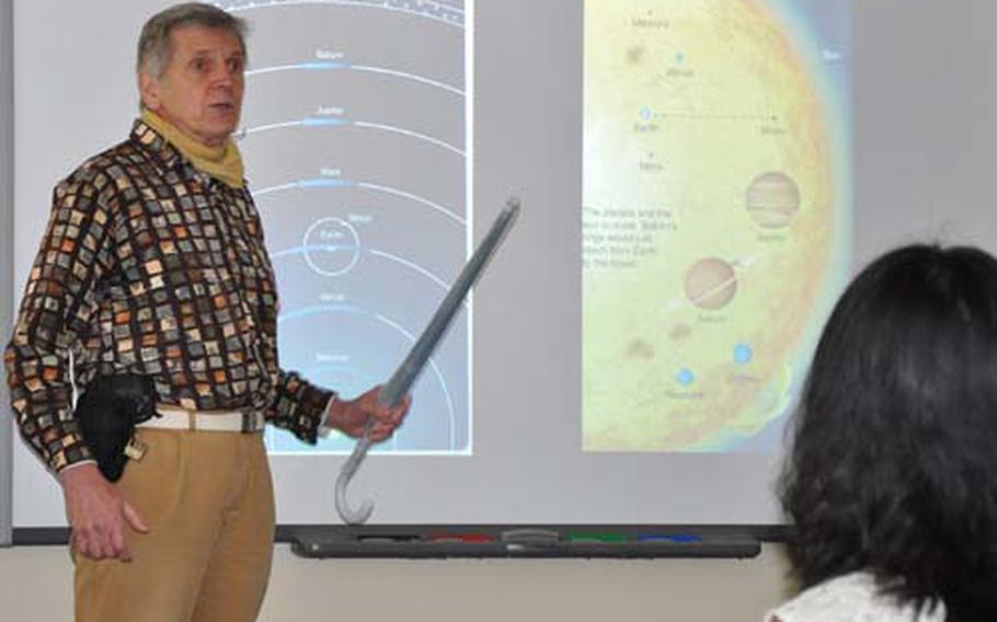 Tom Ewing, an astronomy professor with the University of Maryland University College-Asia, explains the exploration of Mars during a lecture at Misawa Air Base, Japan, on Friday.