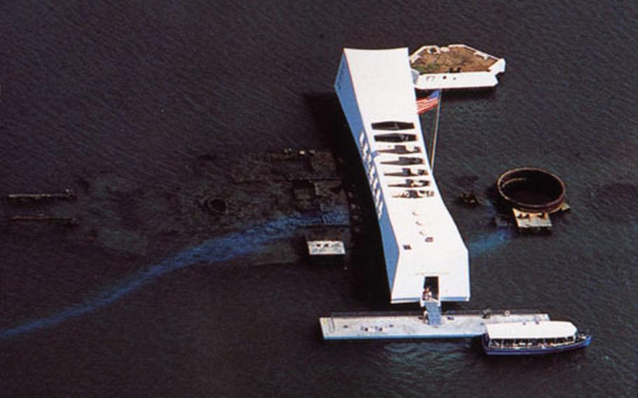A 1991 aerial view of the USS Arizona Memorial at Pearl Harbor shows the outline of the sunken ship.