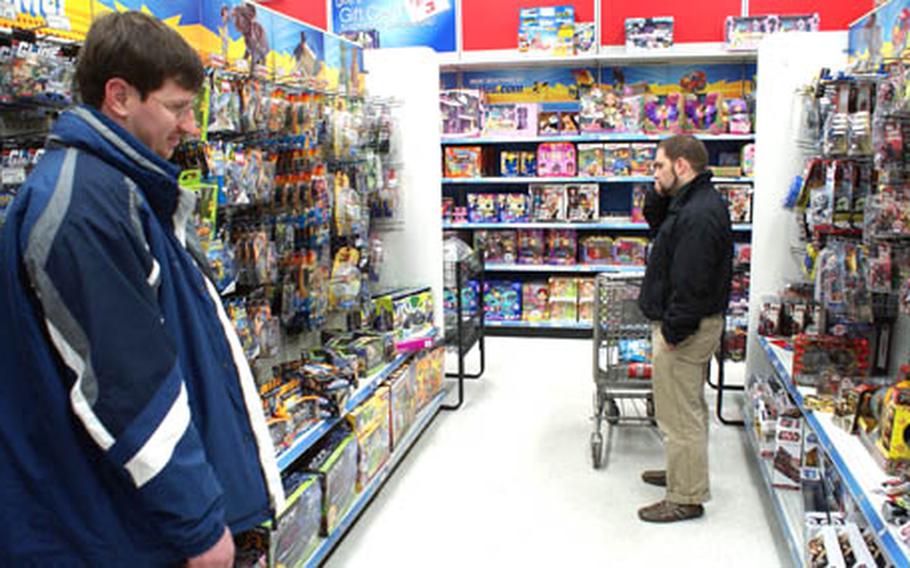 Shoppers at Yongsan Garrison, South Korea, check the shelves of the AAFES toy store last week.