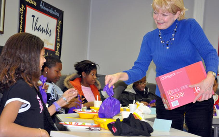 Bamberg school counselor Beverly Brinn passes out holiday goodie bags to members of her deployment group.