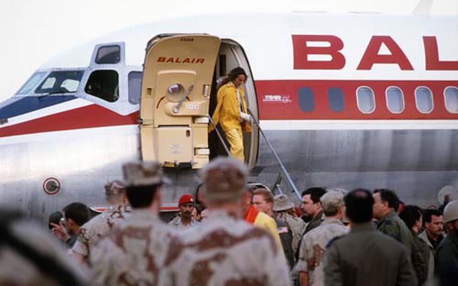 Maj. Rhonda Lee Cornum disembarks an International Red Cross DC-9 aircraft from Geneva at the Riyadh Air Base upon her release by the Iraqi government during Operation Desert Storm.