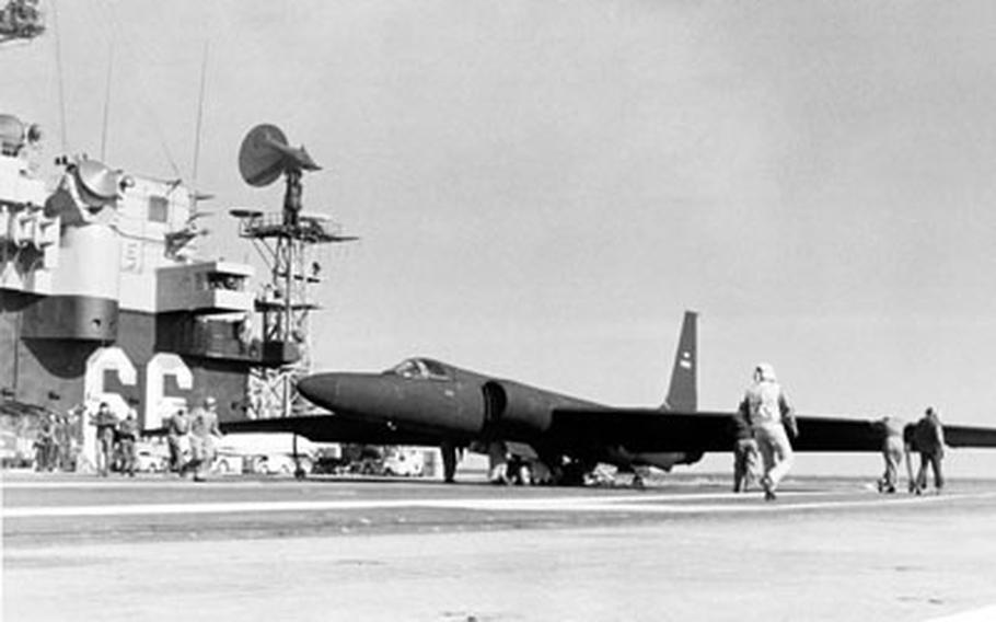 A U-2 reconnaissance aircraft is parked on the flight deck of the aircraft carrier USS America in 1984.