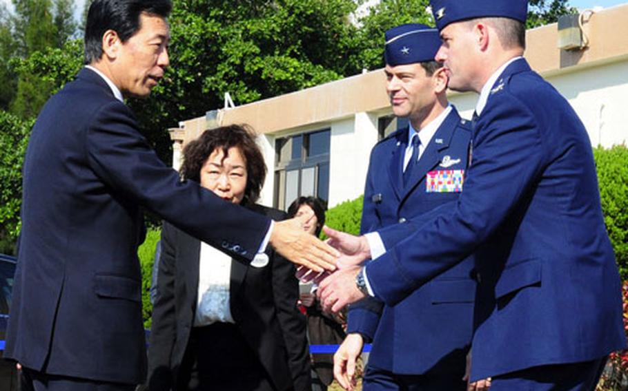 Japan chief cabinet secretary Hirofumi Hirano, left, meets Gen. Ken Wilsbach, 18th Wing commander, second from right, and Col. Lenny Richoux, 18th Wing vice commander, right, at Kadena Air Base, Okinawa, on Saturday.
