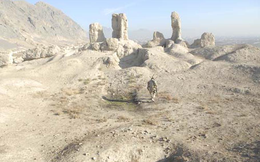 A Canadian soldier walks on top of a fortress on the outskirts of Kandahar that locals claim was built by Alexander the Great. The soldier, who goes only by Sgt. Tom for security reasons, was leading a community patrol with the Kandahar Provincial Reconstruction Team aimed at reaching out to local Afghans.