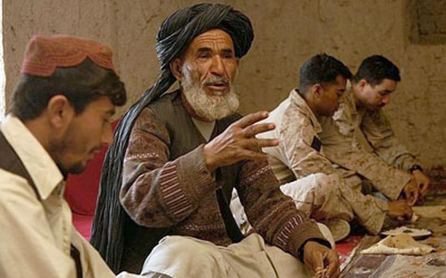 Sarwar Khan, a village elder in southern Nawa, talks with Marines about the upcoming military offensive. The military operation is the subject of much speculation in the towns that surround Marjeh. And there are indications that some Taliban are hiding out in small villages in places such as Narwa.