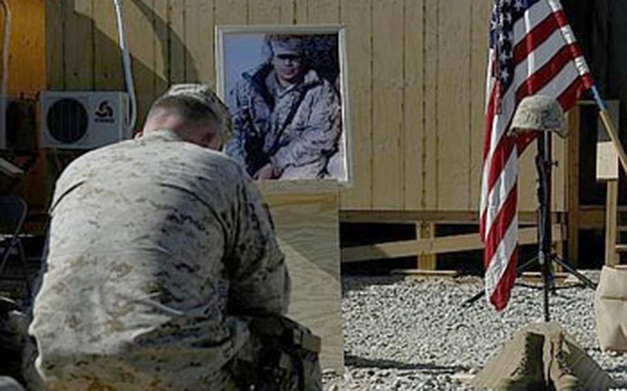 Gen. Larry Nicholson, commander of Marine Expeditionary Brigade-Afghanistan, mourns during a memorial for a Marine killed earlier this month in Helmand province. Lance. Cpl. Mark Juarez was killed Jan. 9, marking the second KIA for the 1st Battalion, 3rd Marines since they arrived in Nawa in December.