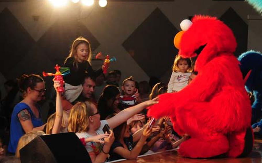 Sesame Street Star Elmo greets fans at the end of The Sesame Street/USO Experience at the Community Center aboard Camp Foster Tuesday. The show is currently on tour throughout the Pacific with the last Okinawa show taking place Feb. 3 on Camp Courtney. The tour then moves to Korea and then Guam.