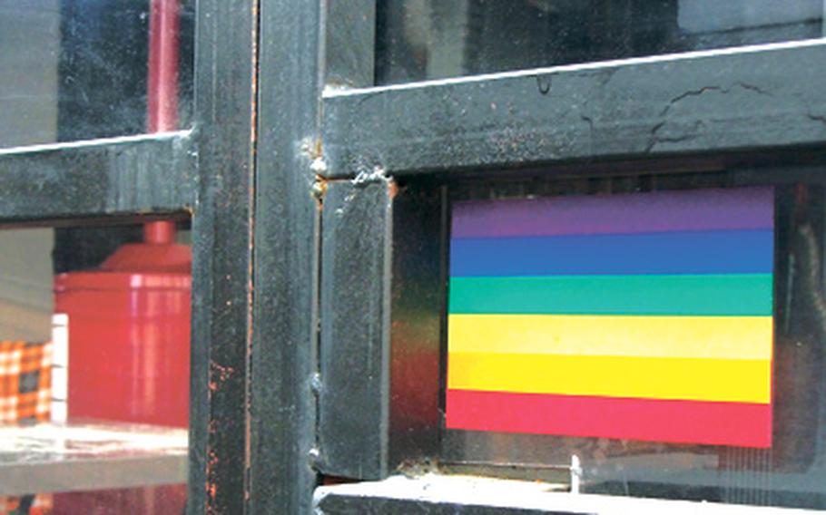 A rainbow sticker hangs in the window of a lounge in Seoul&#39;s gay-friendly Homo Hill district, which attracts both gay and straight customers, including U.S. troops.